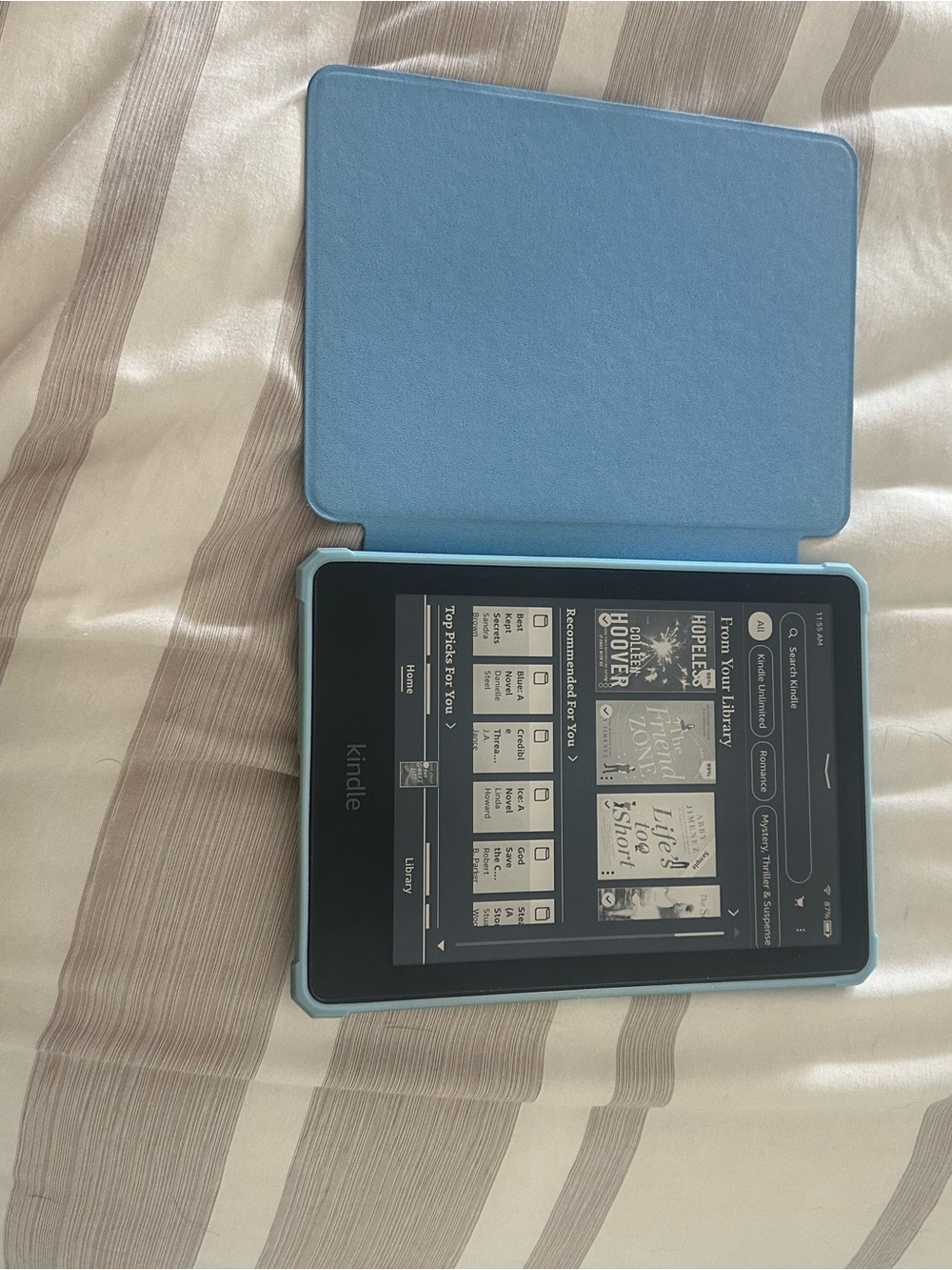 Amazon Kindle Paperweight with Light Blue Protective Cover